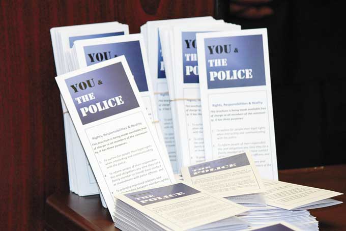 ONE IS TOO MANY—Some of the 1,000 printed copies of the revised “You & The Police” brochure. (Photos by J.L. Martello)