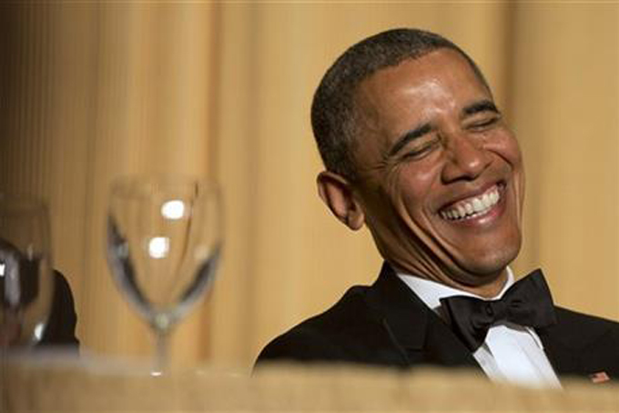 In this May 3, 2014 file photo, President Barack Obama laughs as actor and comedian Joel McHale speaks during the White House Correspondents' Association (WHCA) Dinner at the Washington Hilton Hotel in Washington. Get ready for a healthy dose of political barbs and celebrity-gazing in the nation’ capital. If it’s spring in Washington, it’s time for the White House Correspondents’ Association’s annual dinner. President Barack Obama had it marked on his Saturday night schedule, so expect some verbal jabs aimed at his political rivals and the reporters who cover him. And maybe even a few at his own expense. (AP Photo/Jacquelyn Martin, File)