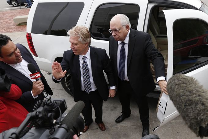 Robert Bates, right, arrives at the Tulsa County Jail with his attorney, Clark Brewster, Tuesday, April 14, 2015, in Tulsa, Okla. (Matt Barnard/Tulsa World via AP)