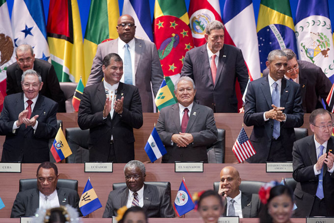 President Barack Obama, right middle row, and Cuba's President Raul Castro, left middle row, applaud with other leaders during the inauguration ceremony of the Summit of the Americas in Panama City, Friday, April 10, 2015. Obama is looking to the Summit of the Americas to chart a less conflictive future with Latin America, a region that has long chafed at Washington's dominance. (AP Photo/Pablo Martinez Monsivais)