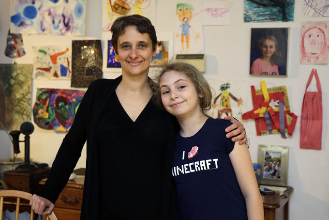 In this Thursday, April 16, 2015 photo, Meredith Barber poses with her daughter Gabrielle Schwager, 10, at their home in Penn Valley, Pa. Barber, a psychologist from the Philadelphia suburb of Penn Valley, has decided Gabrielle will not be taking the Pennsylvania System of School Assessment this year and has been encouraging other parents to opt out. (AP Photo/Matt Slocum)