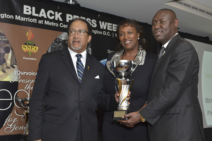 NNPA President and CEO Benjamin F. Chavis, Jr. (left) and Publisher Natalie Cole present Newsmaker of the Year award to Attorney Ben Crump (NNPA Photo by Freddie Allen)