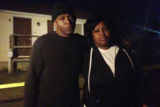 Lloyd Edwards, left, and Bonnie Edwards, the stepfather and mother of Rodney Todd stand outside the home where Todd and his seven children found dead Monday, April 6, 2015, in Princess Anne, Md. Police found the bodies at the home after being contacted by a concerned co-worker of the father, who had not been seen for days, Princess Anne police said in a news release. (AP Photo/Juliet Linderman)