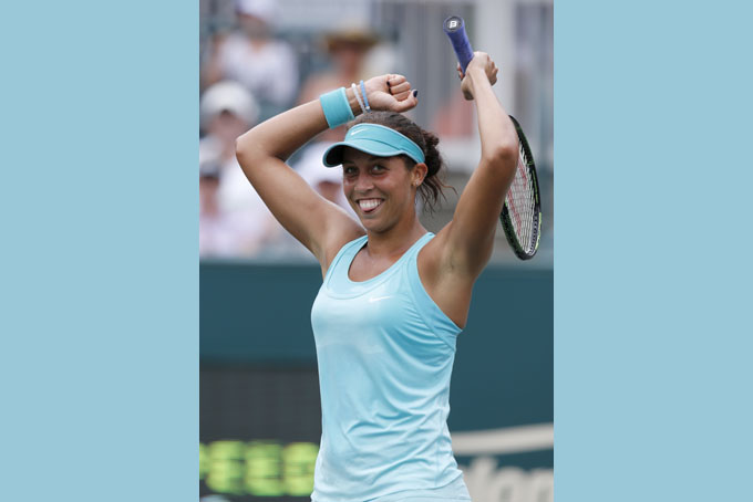 Madison Keys celebrates her victory over Lucie Hradecka during semifinal action at the Family Circle Cup tennis tournament in Charleston, S.C., Saturday, April 11, 2015. (AP Photo/Mic Smith)