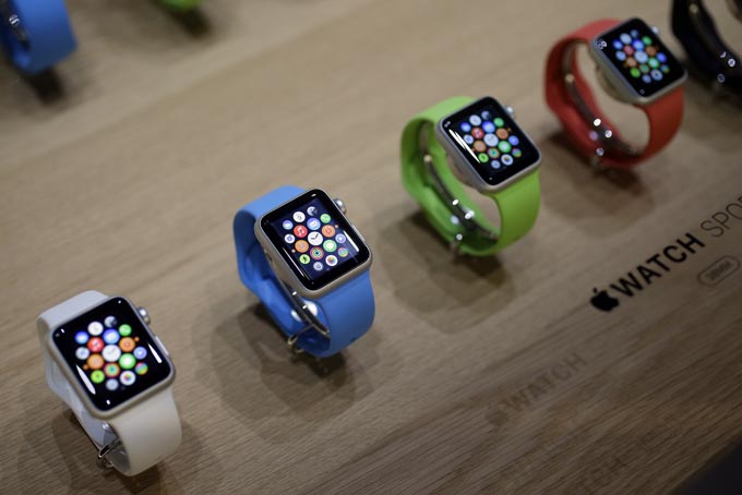 In this March 9, 2015, file photo, varieties of the new Apple Watch appear on display in the demo room after an Apple event in San Francisco. Pre-orders for the Apple Watch start April 10. The device costs $349 for a base model, while a luxury gold version will go for $10,000. (AP Photo/Eric Risberg, File)