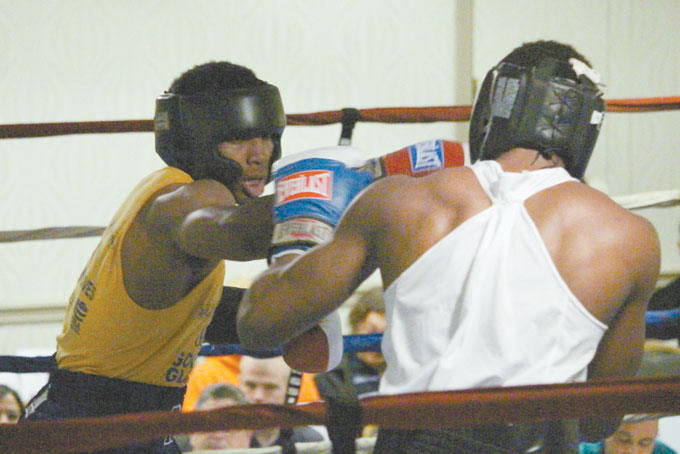 INSIDE ACTION—Eric Sydnor from Ray Schafer’s gym  lands a right jab to the face of Kiante Irving from Stay off the Streets gym  
