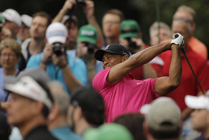 Tiger Woods tees off on the ninth hole during a practice round for the Masters golf tournament Tuesday, April 7, 2015, in Augusta, Ga. (AP Photo/Matt Slocum)