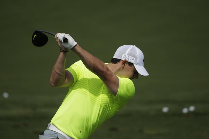 Rory McIlroy, of Northern Ireland, hits on the driving range during a practice round for the Masters golf tournament Tuesday, April 7, 2015, in Augusta, Ga. (AP Photo/Chris Carlson)