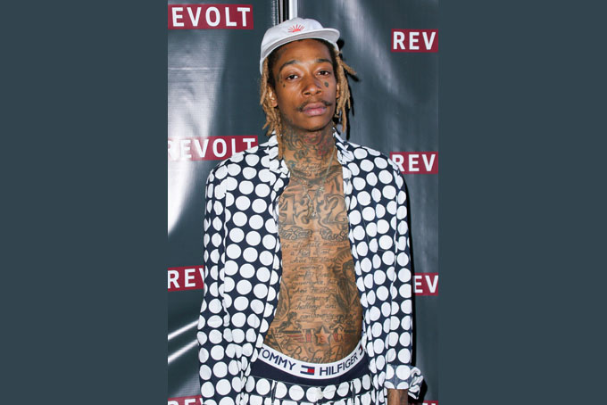 In this April 1, 2015 file photo, Wiz Khalifa arrives at the "Furious 7" Takeover held at the Revolt Live Studios in Los Angeles.  (Photo by John Salangsang/Invision/AP, File)