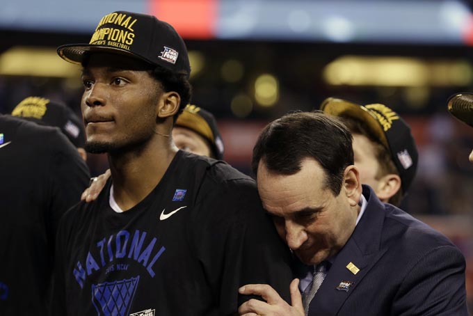 Duke head coach Mike Krzyzewski, right, celebrates with Justise Winslow after their 68-63 victory over Wisconsin in the NCAA Final Four college basketball tournament championship game Monday, April 6, 2015, in Indianapolis.(AP Photo/David J. Phillip)