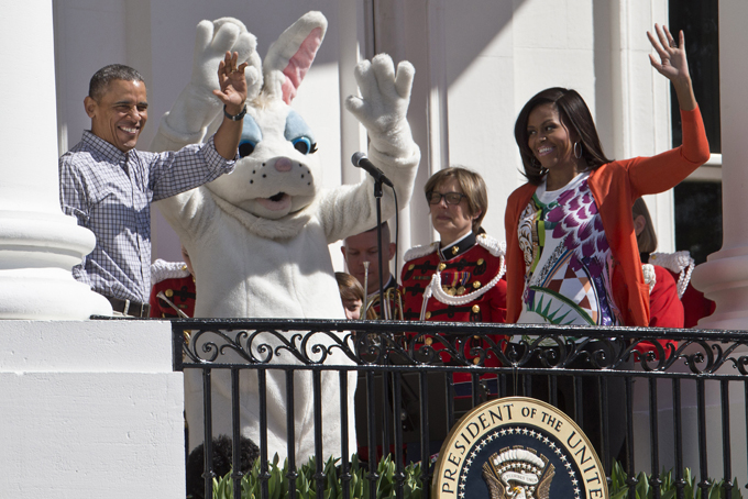 President Barack Obama and first lady Michelle Obama wave with the Easter Bunny as they greet guests participating in the White House Easter Egg Roll on the South Lawn of White House in Washington, Monday, April 6, 2015.  (AP Photo/Jacquelyn Martin)