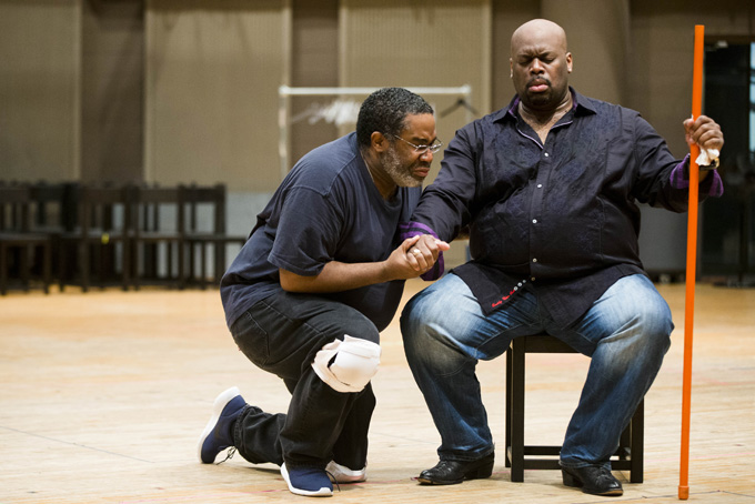 In this Wednesday, April 8, 2015 photo, Eric Owens, left, and Morris Robinson perform during a rehearsal of the opera "Don Carlo," at the Academy of Music in Philadelphia. Five performances are scheduled to be staged from April 24 to May 3. (AP Photo/Matt Rourke)