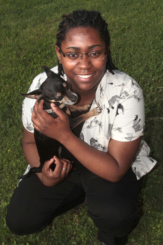 This April 2015 photo shows Claudetteia Love and her dog. (Margaret Croft/The News-Star via AP)