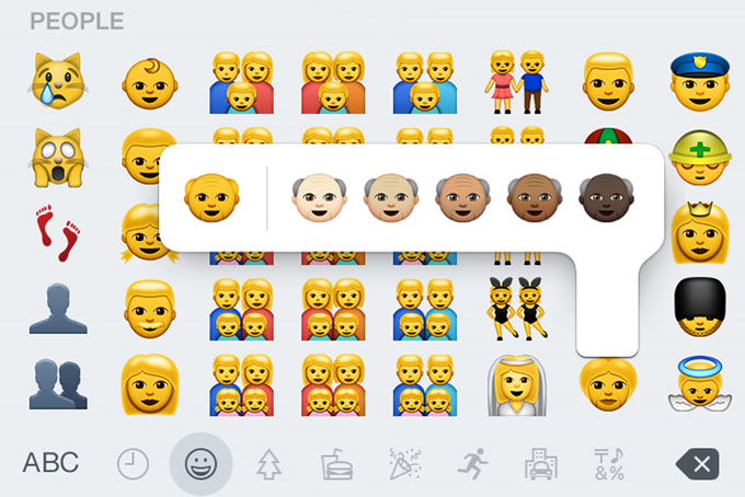 This screen shot made Thursday, April 9, 2015 on an iPhone 6 shows some of the new emojis available with the iOS 8.3 software update. The batch of more than 300 new emojis includes ones different skin tones and depictions of families with two moms or two dads. (AP Photo)