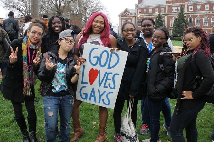 A group of students pose for a picture during a counterprotest against Westboro Baptist Church members (not shown) on the campus of Howard University. Church members were on campus protesting Howard University School of Law’s organization for lesbians, gays, bisexuals, and transgender and queer students. (Shenarri Freeman/HUNS)