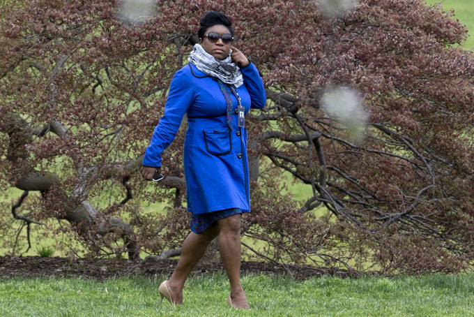  In this photo taken April 15, 2015, Deesha Dyer walks across the South Lawn of the White House in Washington to attend the seventh annual White House Kitchen Garden Planting withfirst lady Michelle Obama.  (AP Photo/Carolyn Kaster)