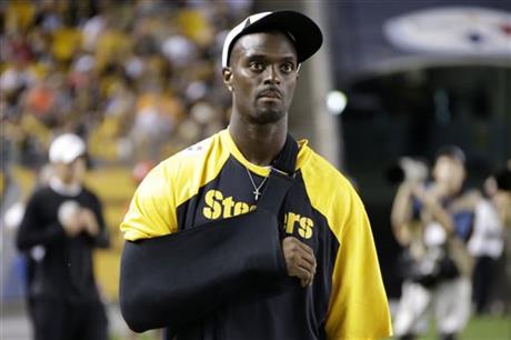 In this Saturday, Aug. 10, 2013, file photograph, Pittsburgh Steelers wide receiver Plaxico Burress (80) stands on the sidelines during an NFL preseason football game against the New York Giants in Pittsburgh. Burress has been indicted on charges he failed to pay taxes, New Jersey prosecutors announced Thursday, April 30, 2015. The 37-year-old former wide receiver with the Pittsburgh Steelers, New York Giants and New York Jets was charged a week earlier with willful failure to pay a state tax and issuing a bad check or electronic funds transfer. (AP Photo/Gene J. Puskar, File)