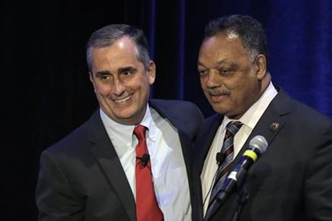 Intel CEO Brian Krzanich left, stands beside Rev. Jesse Jackson prior to speaking at the PUSHTech2020 Summit Wednesday, May 6, 2015, in San Francisco. Jackson and his Rainbow Push organization are holding the summit as part of a year-old campaign to pressure tech companies into hiring and promoting more minorities and women. (AP Photo/Ben Margot)