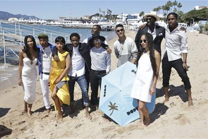 From left, Chanel Iman, Pharell Williams, Kiersey Clemons, Shameik Moore, Amin Joseph, Tony Revolori, Quincy Brown, Zoe Kravitz, Rick Famuyiwa and A$AP Rocky pose for photographers during a photo call for the film Dope, at the 68th international film festival, Cannes, southern France, Friday, May 22, 2015. (Photo by Joel Ryan/Invision/AP)