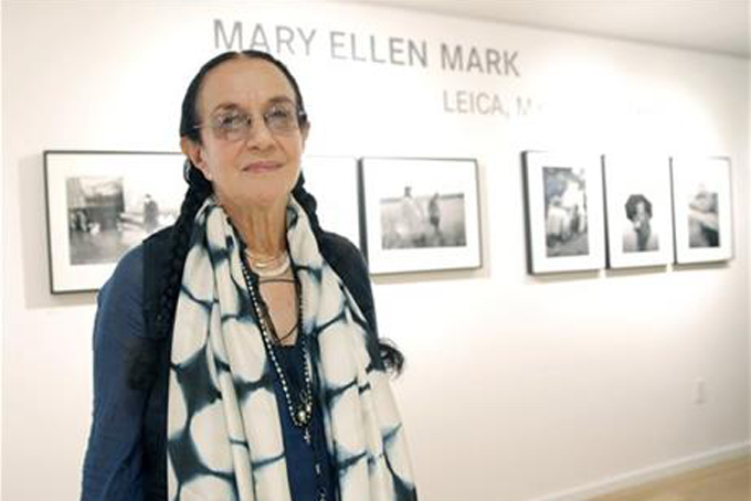 In this June 20, 2013, file photo provided by Leica, photographer Mary Ellen Mark attends the Leica Los Angeles Grand Opening in Los Angeles. Mark, a renowned documentary photographer whose subjects ranged from runaway children to world leaders died Monday, May 25, 2015, in New York. She was 75 years old. (Todd Williamson/Leica via AP, File)