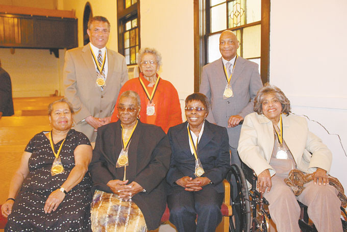 ANNIVERSARY—Trinity AME Church, located at 2700 Wylie Ave., in the Hill District, recently hosted its 112th church anniversary. The celebration, entitled “Heritage Day,” included a memorial service to remember its deceased members; a service to honor its lifetime and 50 year members; and a small repast. Pictured above are individuals who have been members of the church for 50 years and more. Seated, from left: Mary Ann Holiday, Arlean Johnson, Zilphia Counts and Alline Davis. Standing, from left: Tim Stevens, Carletta Williams and Luther Sewell Jr. (Photos by J.L. Martello) 