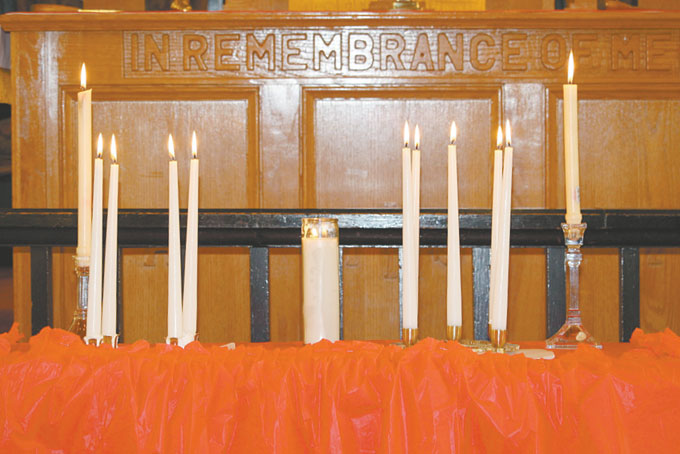 CANDLES lit in memory of those members who are no longer living. 