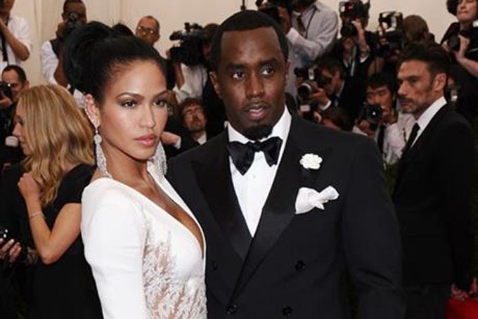 In this May 4, 2015 file photo, Cassie, left, and Sean "Diddy" Combs arrive at The Metropolitan Museum of Art's Costume Institute benefit gala celebrating "China: Through the Looking Glass" in New York. Forbes recently named him the wealthiest hip-hop artist, and his fragrances, his latest being 3AM, have earned him a couple of FiFi Awards. (Photo by Charles Sykes/Invision/AP, FIle)