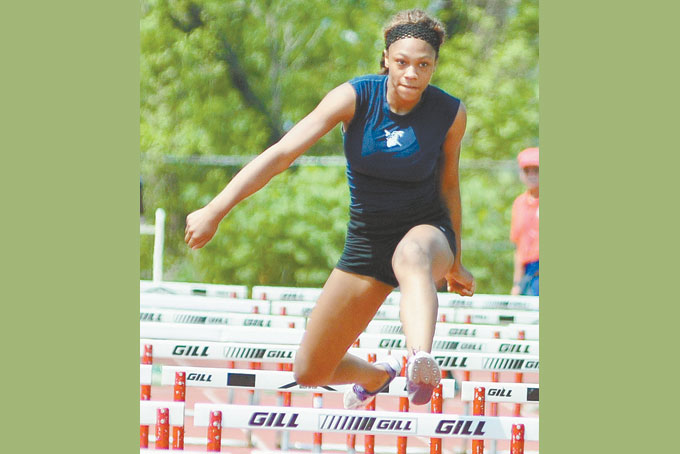FANTASTIC FRESHMAN—Asia Parker , a freshman from Carrick won the 100 meter and the 300 meter hurdles and also won the Long Jump event. (Photos by William McBride) 
