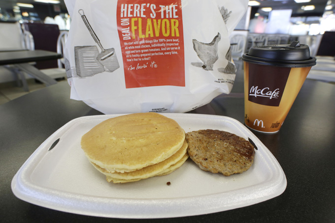 In this Feb. 14, 2013 file photo, a McDonald's breakfast is arranged for an illustration  at a McDonald's restaurant in New York.  After decades of complaints from customers that breakfast wasnt available past 10:30 a.m., McDonalds is testing an all-day breakfast menu in San Diego. If successful, its just one way the company could boost customer traffic. (AP Photo/Mark Lennihan)