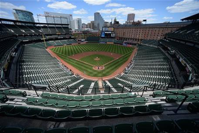 Baltimore Orioles pitcher Ubaldo Jimenez delivers a pitch against the Chicago White Sox in the first inning of a baseball game without fans Wednesday, April 29, 2015, in Baltimore. Due to security concerns the game was closed to the public. (AP Photo/Gail Burton)