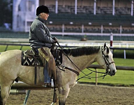 Hall of Fame trainer D. Wayne Lukas watches horses train before sunrise at Churchill Downs in Louisville, Ky., Wednesday, April 29, 2015. (AP Photo/Garry Jones)