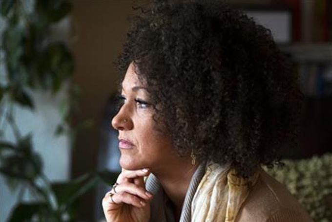 In this March 2, 2015 file photo, Rachel Dolezal, president of the Spokane chapter of the NAACP, poses for a photo in her Spokane, Wash. home. Friday, June 12, 2015. (Colin Mulvany/The Spokesman-Review via AP, File) 