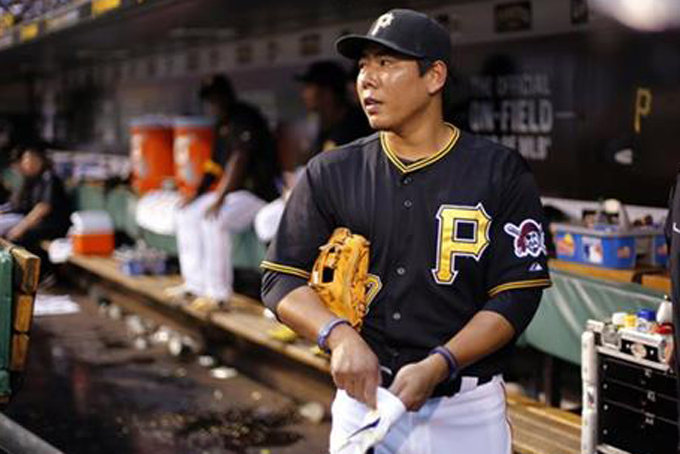 In this June 8, 2015, file photo, Pittsburgh Pirates' Jung Ho Kang, of South Korea, prepares to take the field during a baseball game against the Milwaukee Brewers in Pittsburgh. Kang isn’t the first South Korean star to be lured west, but perhaps the most ambitious. (AP Photo/Gene J. Puskar, File)