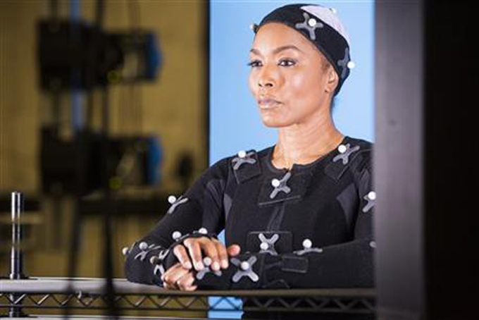 This undated photo provided by Ubisoft shows actress Angela Bassett during a motion capture session for her character, in the video game, “Rainbow Six: Siege.” The actress and filmmaker is taking on the mantle of "Six," the codename for the leader of the elite counter-terrorism group depicted in "Tom Clancy's Rainbow Six." Bassett was unveiled Monday, June 15, 2015, during Ubisoft's press conference at the Electronic Entertainment Expo as the latest "Six" in the upcoming "Rainbow Six: Siege" installment of the publisher's long-running shooter series. (Colin Young-Wolff/Ubisoft via AP)