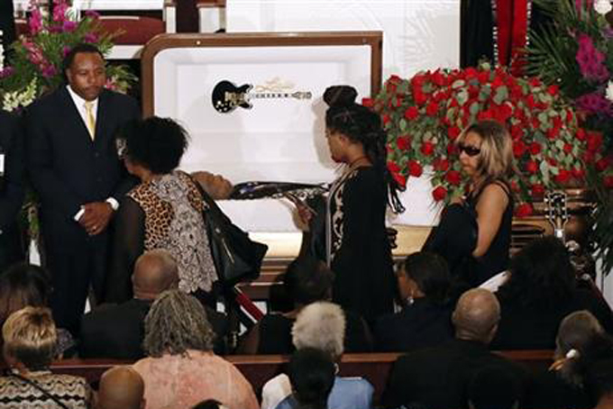 Friends and family file past the casket bearing blues legend B.B. King prior to his funeral Mass at Bell Grove Missionary Baptist Church in Indianola, Miss., Saturday, May 30, 2015. (AP Photo/Rogelio V. Solis, Pool)