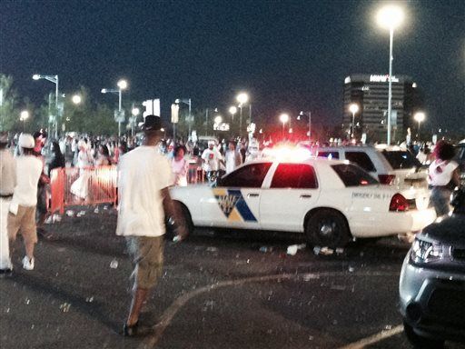 Fans at the Hot 97 Summer Jam concert confront police officers outside the MetLife Stadium in East Rutherford, N.J., Sunday, June 7, 2015. Crowds on Sunday night became upset when the gates were closed and blocked off by police in riot gear, the Asbury Park Press reported. (Chris Jordan/The Asbury Park Press via AP) 