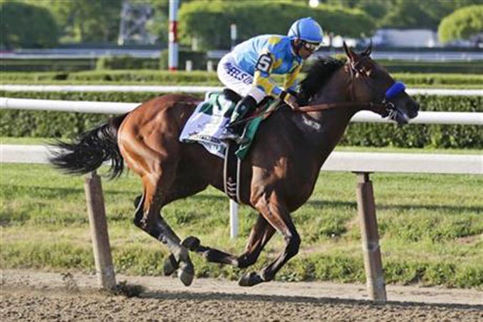 American Pharoah, with Victor Espinoza up, rides during the 147th running of the Belmont Stakes horse race Saturday, June 6, 2015, in Elmont, N.Y. (AP Photo/Frank Franklin II)
