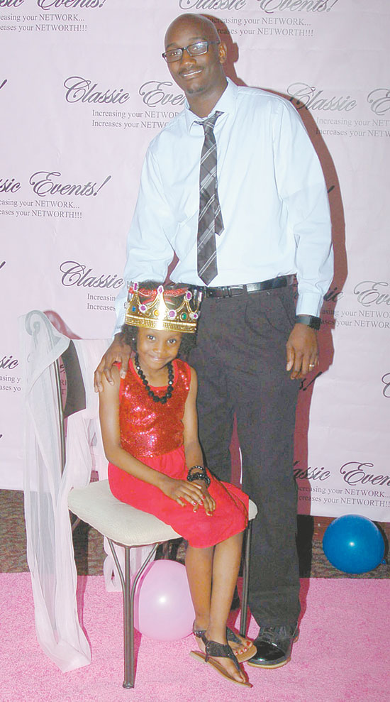 QUEEN FOR THE DAY—Azeria, 7, and her father, Andrew Bates, celebrate her crowning as the queen of the evening.