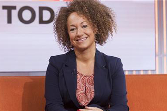 In this image released by NBC News, former NAACP leader Rachel Dolezal appears on the "Today" show set on Tuesday, June 16, 2015, in New York. Dolezal, who resigned as head of a NAACP chapter after her parents said she is white, said Tuesday that she started identifying as black around age 5, when she drew self-portraits with a brown crayon, and "takes exception" to the contention that she tried to deceive people. Asked by Matt Lauer if she is an "an African-American woman," Dolezal said: "I identify as black." (Anthony Quintano/NBC News via AP)