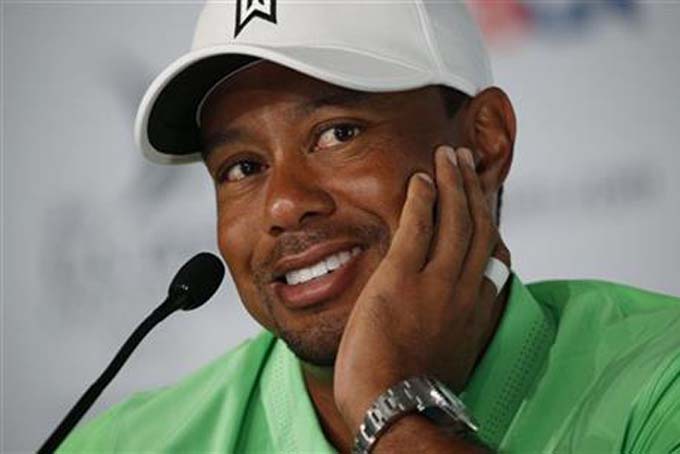 Tiger Woods talks speaks to the media during a news conference for the U.S. Open golf tournament at Chambers Bay on Tuesday, June 16, 2015 in University Place, Wash. (AP Photo/John Locher)