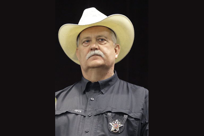Waller County sheriff Glenn Smith listens to a speaker at a press conference Tuesday, July 21, 2015, in Prairie View, Texas following a meeting regarding the investigation into the jail cell death of Sandra Bland. Video of the confrontational stop of Sandra Bland ignited long-simmering passions and caused some blacks to raise their guard around law enforcement in Waller County and the county seat of Hempstead, once known as ìSix Shooter Junctionî because of white supremacist violence in the 1800s.(AP Photo/Pat Sullivan)
