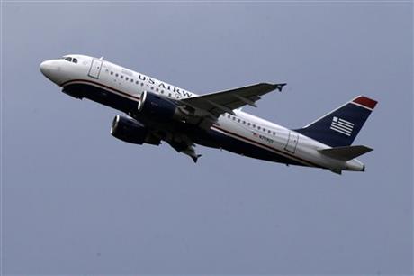 FILE - In this July 23, 2013, file photo, a US Airways jet takes off from Pittsburgh International Airport in Imperial, Pa. The last flight for US Airways will take place in fall 2015, and then one more name in airline history will disappear. American and US Airways merged in December 2013 and decided to keep the better-known American name. (AP Photo/Gene J. Puskar, File)