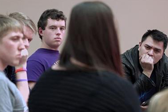 In this image released by MTV, filmmaker Jose Antonio Vargas, right, listens to a group of young people during the filming of his documentary "White People." The full film debuts Wednesday, July 22, at 8 p.m. ET/PT, offered simultaneously online. (MTV via AP)