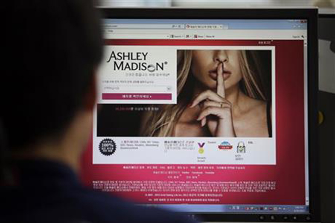  In this June 10, 2015 photo, Ashley Madison's Korean web site is shown on a computer screen in Seoul, South Korea. Avid Life Media Inc., the parent company of Ashley Madison, a matchmaking website for cheating spouses, said it was hacked and that the personal information of some of its users was posted online. The breach was first reported late Sunday, July 19, 2015, by Brian Krebs of Krebs on Security, a website that focuses on cybersecurity. (AP Photo/Lee Jin-man, File)