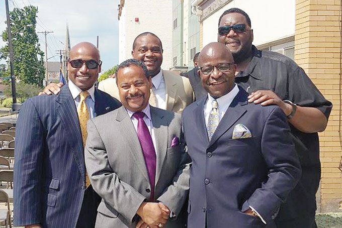 BUILDING A NEW LARIMER TOGETHER—Back row, from left: Keith B. Key, Ed Gainey and Emmitt Miles along with Brian Hudson and Nate Bowe, front row, are all smiles following the Larimer Pointe ribbon cutting. (Photo courtesy of Ed Gainey)