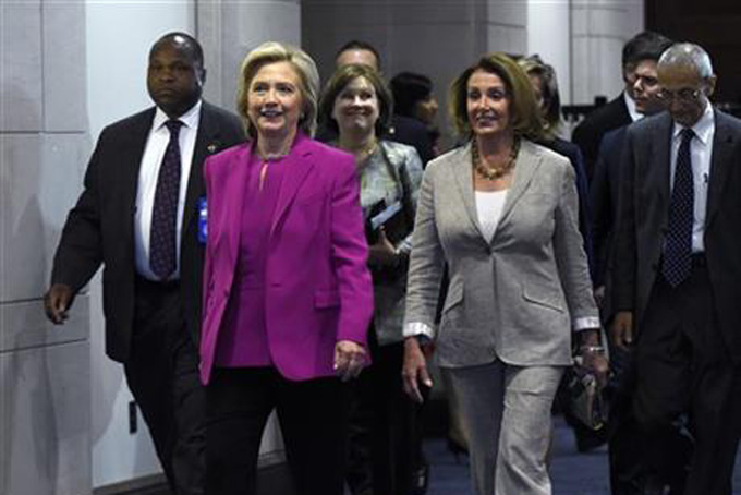 Democratic presidential candidate Hillary Rodham Clinton walks with House Minority Leader Nancy Pelosi of Calif. on Capitol Hill in Washington, Tuesday, July 14, 2015. Clinton is attend meetings on Capitol Hill with House and Senate Democrats. (AP Photo/Susan Walsh)
