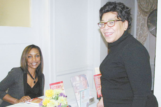 AN EXCHANGE OF INFORMATION—Author and entrepreneur, Sharise Hemby shares information with Michelle Jones, the new publisher of The Greater Pittsburgh Black Business Directory.   