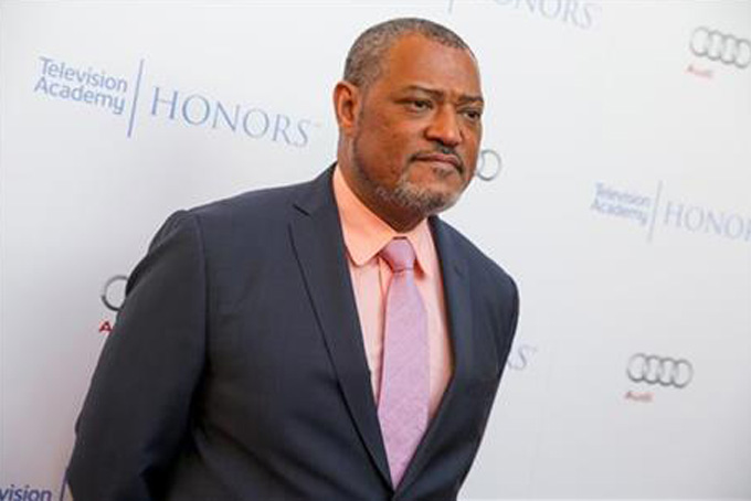 In this May 27, 2015 file photo, Laurence Fishburne arrives at the 2015 Television Academy Honors at The Montage Hotelin Beverly Hills, Calif. Fishburne will star as Alex Haley in the A+E Networks scripted event series, "Roots." (Photo by Rich FuryInvision/AP, File)