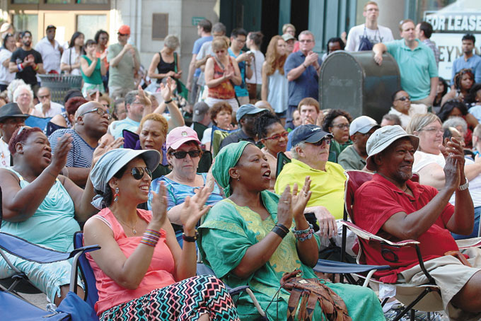 ENJOYING THE DAY—The crowd cheering on Etienne Charles and his group.