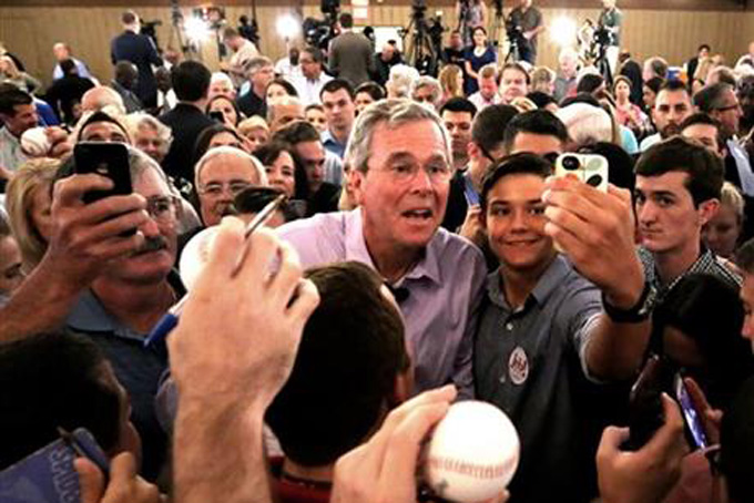 2016 Republican presidential candidate Jeb Bush greets supporters during a campaign rally at the Maitland Venue in Maitland, Fla., Monday, July 27, 2015. (Joe Burbank/Orlando Sentinel via AP) 